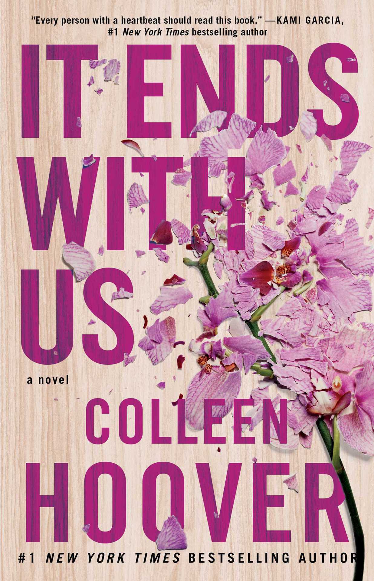 Book cover of 'It Ends with Us' by Colleen Hoover with pink flowers and wooden texture.