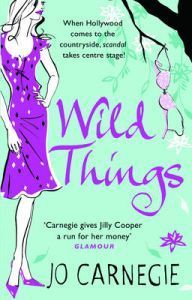 Book cover of 'Wild Things' by Jo Carnegie with a stylized illustration of a woman in a purple dress.