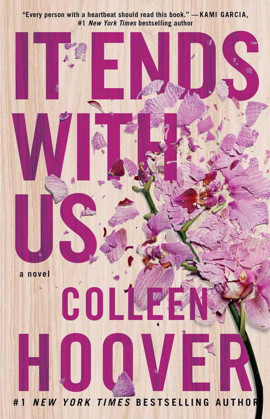 Book cover of 'It Ends with Us' by Colleen Hoover with pink flowers and wooden texture.